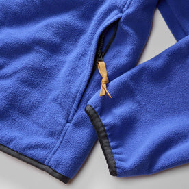 material shot of the zip pocket on The Trail Fleece in Alpine Dusk, Outerwear by Taylor Stitch