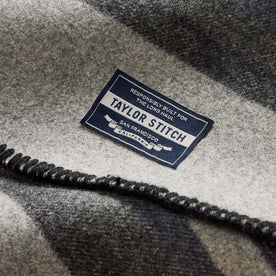 material shot of the tag on The Wool Blanket in Bay Stripe, Accessories by Taylor Stitch