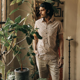 fit model standing by potted plants in The Short Sleeve California in Coastal Flora, Wovens by Taylor Stitch