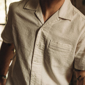 fit model showing the camp collar and texture on vhe Short Sleeve Hawthorne in Birch, Wovens by Taylor Stitch