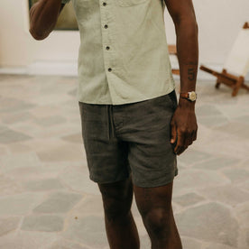 fit model posing in The Apres Short in Faded Black Hemp, Bottoms by Taylor Stitch