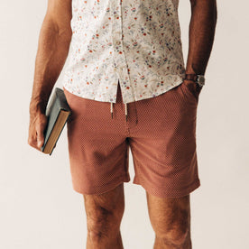 fit model with his hand in his pocket wearing The Apres Short in Fired Brick Dobby, Bottoms by Taylor Stitch