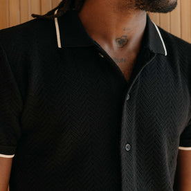 fit model showing off the collar on The Button Down Polo in Coal Herringbone, Knits by Taylor Stitch