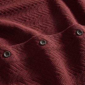 material shot of the buttons on The Button Down Polo in Dried Cherry Herringbone, Knits by Taylor Stitch