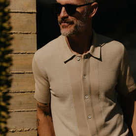 fit model showing off texture on The Button Down Polo in Faded Khaki Seed Stitch, Knits by Taylor Stitch