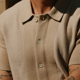 fit model showing off texture on The Button Down Polo in Faded Khaki Seed Stitch, Knits by Taylor Stitch