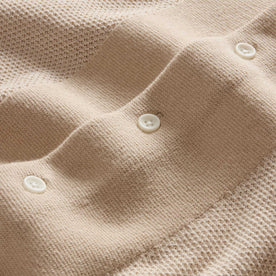 material shot of the buttons on The Button Down Polo in Faded Khaki Seed Stitch, Knits by Taylor Stitch