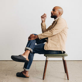 fit model sitting wearing The Ojai Jacket in Organic Light Khaki Foundation Twill, Outerwear by Taylor Stitch