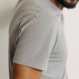 fit model showing off the sleeves on The Organic Cotton Tee in Overcast, Knits by Taylor Stitch