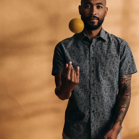 fit model throwing a ball wearing The Short Sleeve California in Blue Chambray Botanical, Wovens by Taylor Stitch