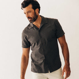 fit model posing in The Short Sleeve Davis Shirt in Kelp Stripe, Wovens by Taylor Stitch