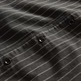 material shot of the buttons on The Short Sleeve Davis Shirt in Kelp Stripe, Wovens by Taylor Stitch