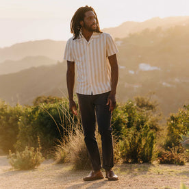 fit model standing wearing The Short Sleeve Davis Shirt in Sandbar Stripe, Wovens by Taylor Stitch