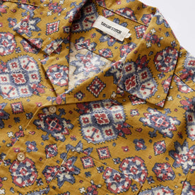 material shot of the collar on The Short Sleeve Davis Shirt in Tarnished Gold Print, Wovens by Taylor Stitch