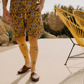 fit model with his hand in the pocket of The Apres Short in Tarnished Gold, Bottoms by Taylor Stitch