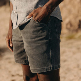 fit model with his hand in his pocket wearing The Camp Short in Coal Chipped Canvas, Bottoms by Taylor Stitch