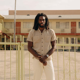 fit model with his arms crossed wearing The Conrad Shirt in Black Coffee Stripe, Wovens by Taylor Stitch