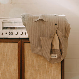 editorial image of The Conrad Shirt in Black Coffee Stripe on a shelf, Wovens by Taylor Stitch