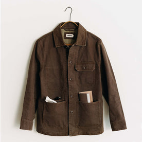 editorial image of The Fremont Jacket in Aged Penny Chipped Canvas on a hanger, Outerwear by Taylor Stitch