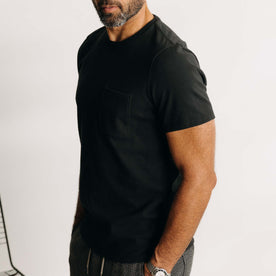 fit model showing off the sleeves on The Heavy Bag Tee in Black, Knits by Taylor Stitch