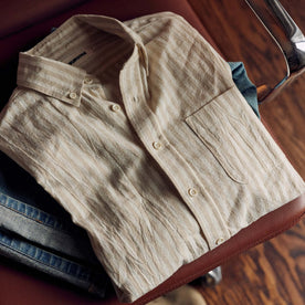 folded flatlay of The Jack in Dried Cacti Stripe on a chair, Wovens by Taylor Stitch