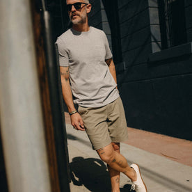 fit model leaning against the wall wearing The Matlow Short in Baked Soil Herringbone, Bottoms by Taylor Stitch