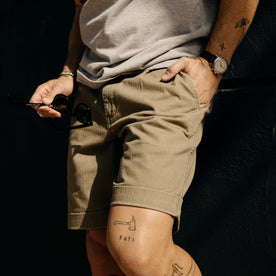 fit model with his hand in his pocket wearing The Matlow Short in Baked Soil Herringbone, Bottoms by Taylor Stitch