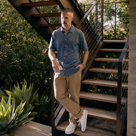 fit model standing in The Short Sleeve California in Washed Indigo Slub, Wovens by Taylor Stitch