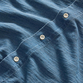 material shot of the buttons on The Short Sleeve California in Washed Indigo Slub, Wovens by Taylor Stitch