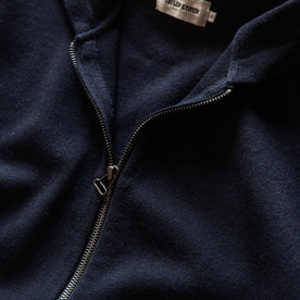 material shot of the antique zipper on The Portola Hoodie in Midnight Merino, Knits by Taylor Stitch