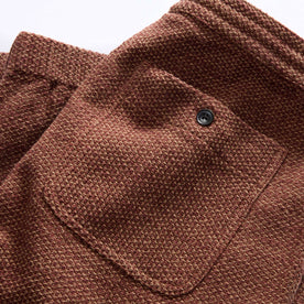 material shot of the back pocket of The Apres Pant in Black Cherry Sashiko, Bottoms by Taylor Stitch