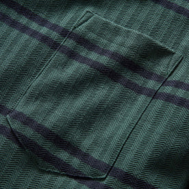 material shot of the front chest pocket on The Colton Crew in Dark Forest Stripe, Knits by Taylor Stitch