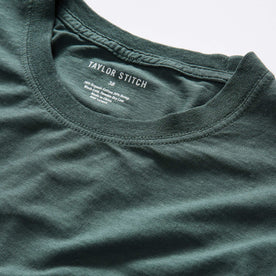 material shot of the neck opening on The Cotton Hemp Long Sleeve Tee in Dark Forest, Knits by Taylor Stitch