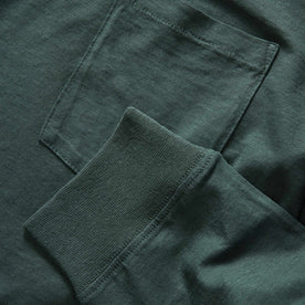 material shot of the ribbed sleeve and chest pocket on The Cotton Hemp Long Sleeve Tee in Dark Forest, Knits by Taylor Stitch