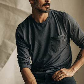 fit model sitting wearing The Cotton Hemp Long Sleeve Tee in Charcoal, Knits by Taylor Stitch