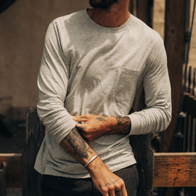 fit model adjusting sleeves on The Cotton Hemp Long Sleeve Tee in Heather Grey, Knits by Taylor Stitch