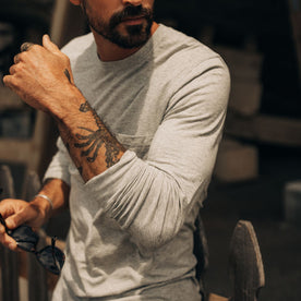 fit model showing off sleeves on The Cotton Hemp Long Sleeve Tee in Heather Grey, Knits by Taylor Stitch