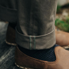 fit model showing off selvage cuffs on The Democratic All Day Pant in Fatigue Olive Selvage Denim, Bottoms by Taylor Stitch