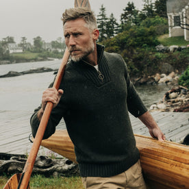 fit model carrying an oar in The Quarter Zip Tanker Sweater in Loden, Knits by Taylor Stitch