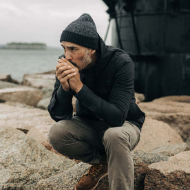 fit model by a lighthouse in The Headland Beanie in Dark Navy, Accessories by Taylor Stitch