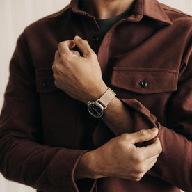 fit model adjusting his sleevs in The Maritime Shirt Jacket in Black Cherry Moleskin, Wovens by Taylor Stitch