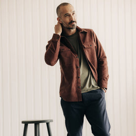 fit model standing in The Maritime Shirt Jacket in Black Cherry Moleskin, Wovens by Taylor Stitch