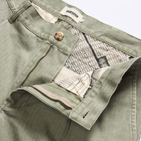 material shot of the waistband on The Matlow Pant in Dried Sage Pigment Herringbone, Bottoms by Taylor Stitch