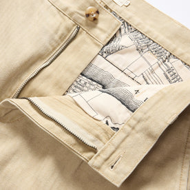 material shot of the waistband on The Matlow Pant in Light Khaki Pigment Herringbone, Bottoms by Taylor Stitch