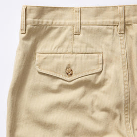 material shot of the back pocket on The Matlow Pant in Light Khaki Pigment Herringbone, Bottoms by Taylor Stitch