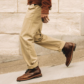 fit model walking in The Matlow Pant in Light Khaki Pigment Herringbone, Bottoms by Taylor Stitch