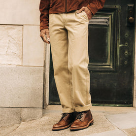 fit model with his hand in his pocket wearing The Matlow Pant in Light Khaki Pigment Herringbone, Bottoms by Taylor Stitch