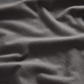 material shot of the fabric on The Organic Cotton Henley in Faded Black, Knits by Taylor Stitch