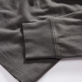 material shot of the sleeve on The Organic Cotton Henley in Faded Black, Knits by Taylor Stitch