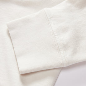 material shot of the sleeves on The Organic Cotton Henley in Vintage White, Knits by Taylor Stitch